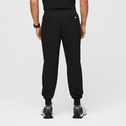 https://cdn.shopify.com/s/files/1/0139/8942/files/Mens-Tansen-Scrub-Pant-black-M-4_ca41b890-5771-40b8-87e3-831b0ac22dd8.jpg?v=1712253246