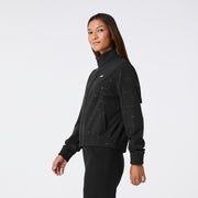 https://cdn.shopify.com/s/files/1/0139/8942/files/Q2_2024_5_BLACK_MADISONEMBOSSEDSCRUBJACKET_CHARO_040.jpg?v=1720221502